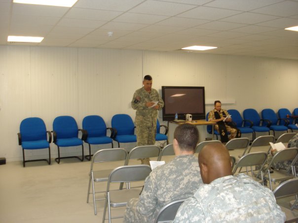 Thanksgiving service at COB Basrah. This is CW3 Klein leading the responsive reading.