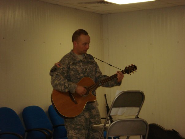 Thanksgiving service at COB Basrah. This is my assistant, SGT Miles leading one of the songs.