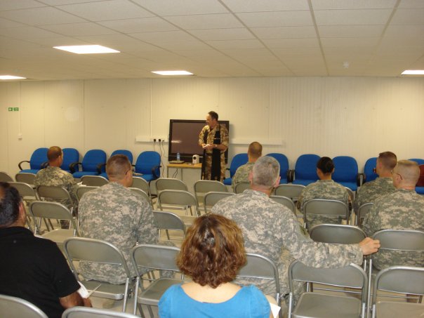 Thanksgiving service at COB Basrah. This is the Senior Joint Forces Chaplain, Padre David Moss praying the invocation for me.