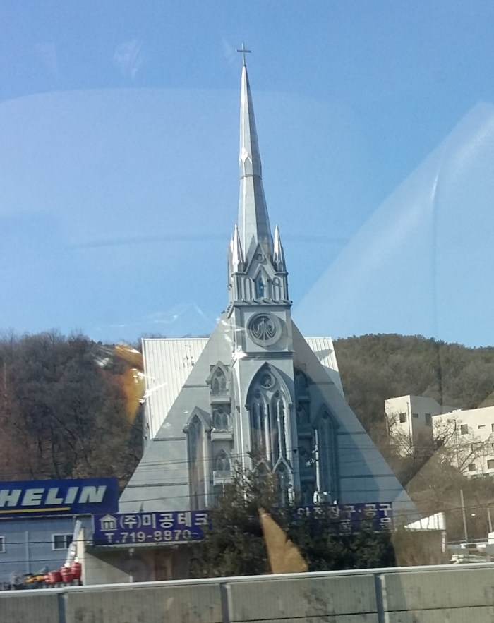 A large modern-Gothic church beside I-1 just inside the Seoul toll gate